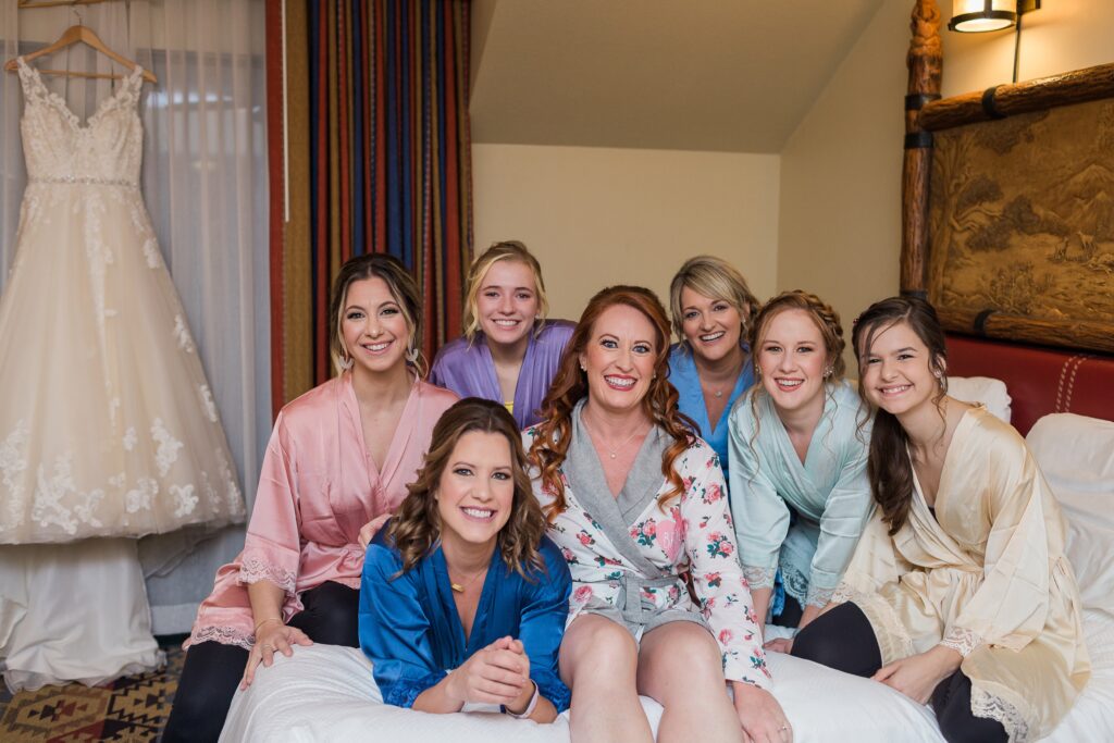 Disney Fairytale Wedding Bridesmaids group shot on bed