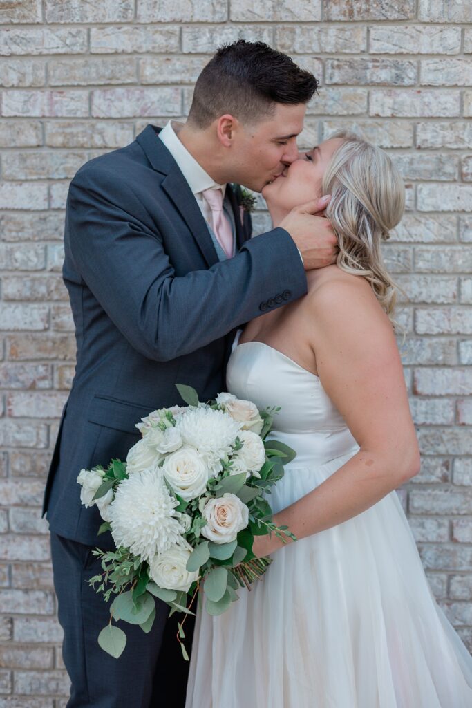 close up of bride and groom kissing