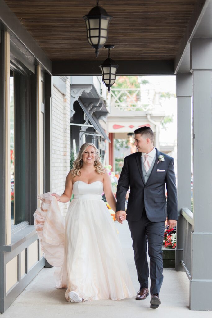bride smiling while they walk hand in hands
