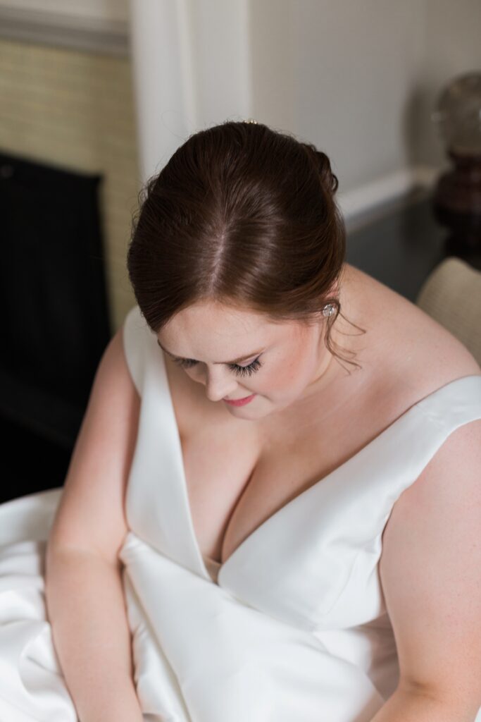 bride at Langdon Hall sitting in chair close up of makeup