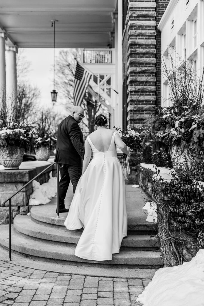 bride and groom walking up stairs at Langdon Hall