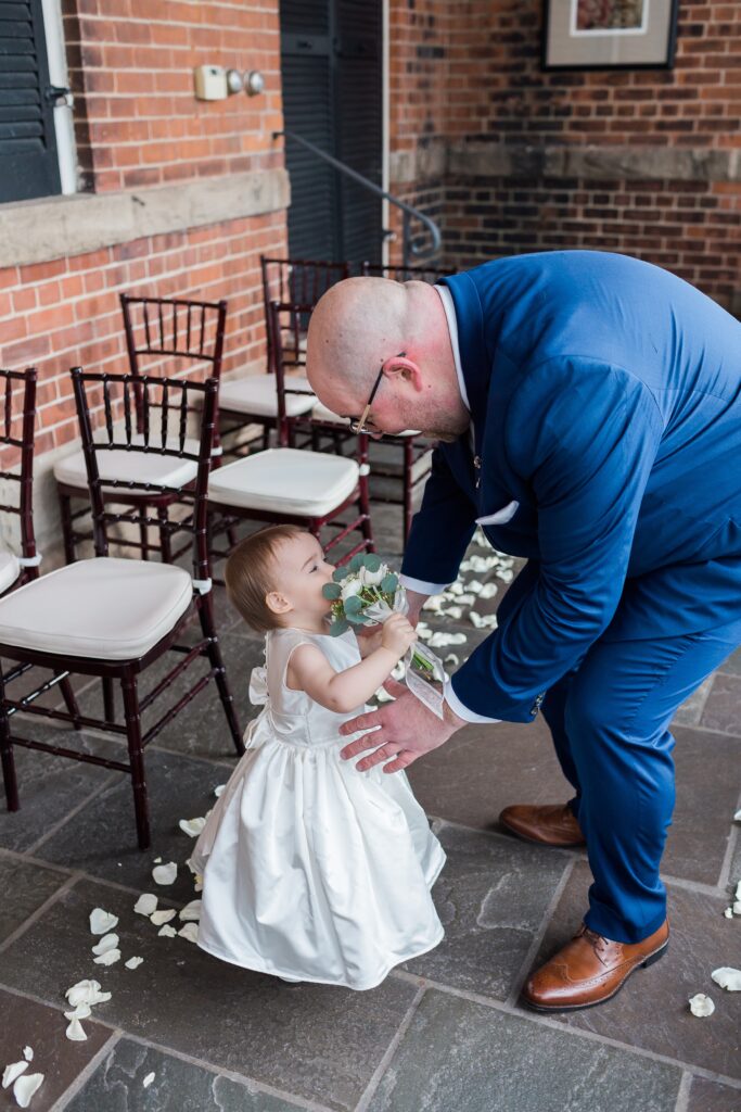flower girl and dad have a first look