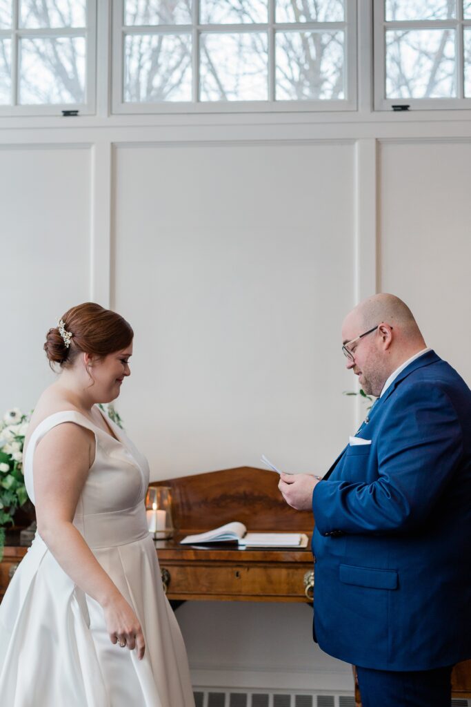 groom reading intimate vows to bride