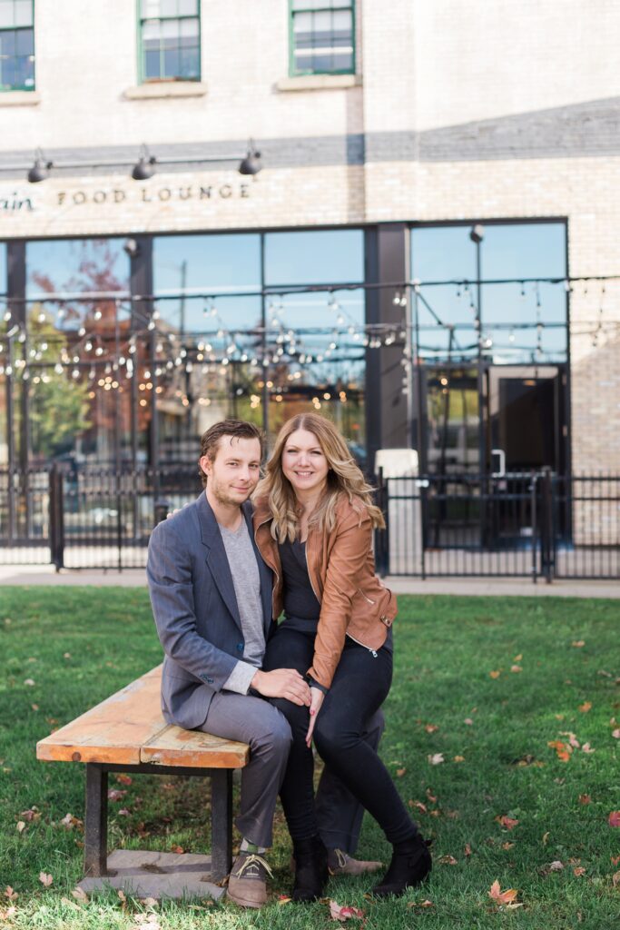 Tannery Kitchener Engagement session couple sitting outside on bench