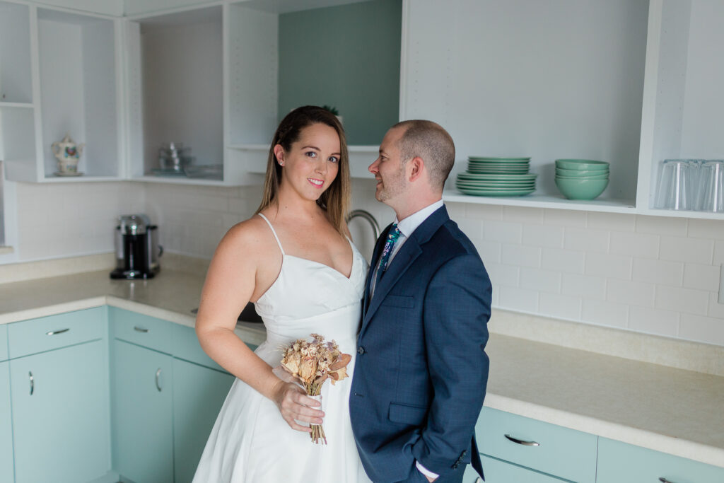Bride and Groom in Kitchen holding each other