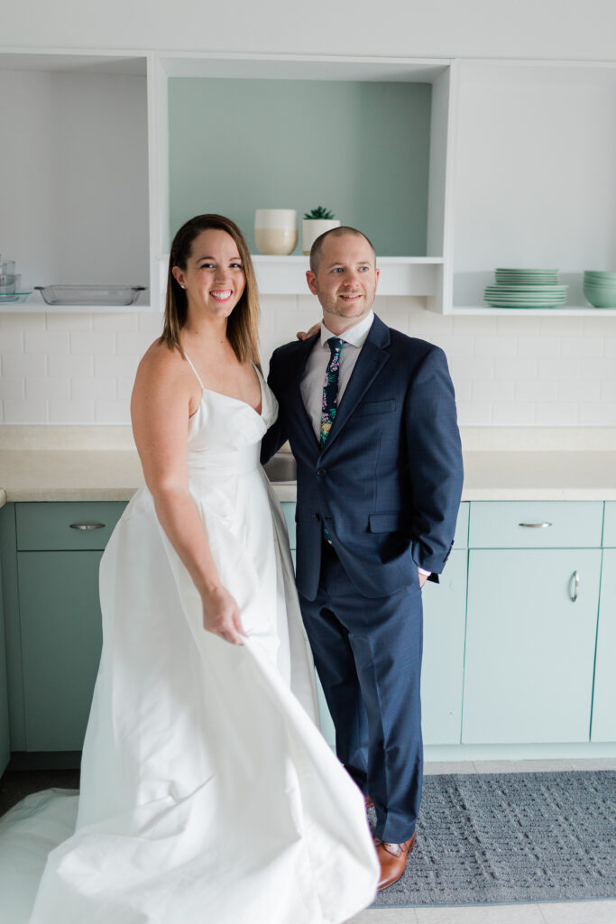 bride and groom standing in kitchen together