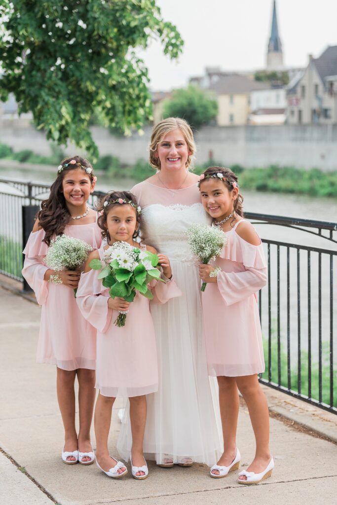 Bride with bridesmaids at Mill Race in Cambridge