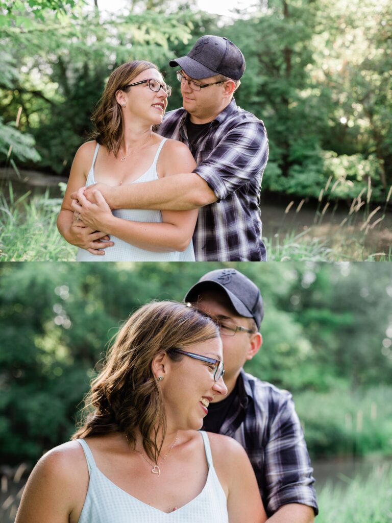 Couple standing and hugging in engagement photo shoot in a field. 