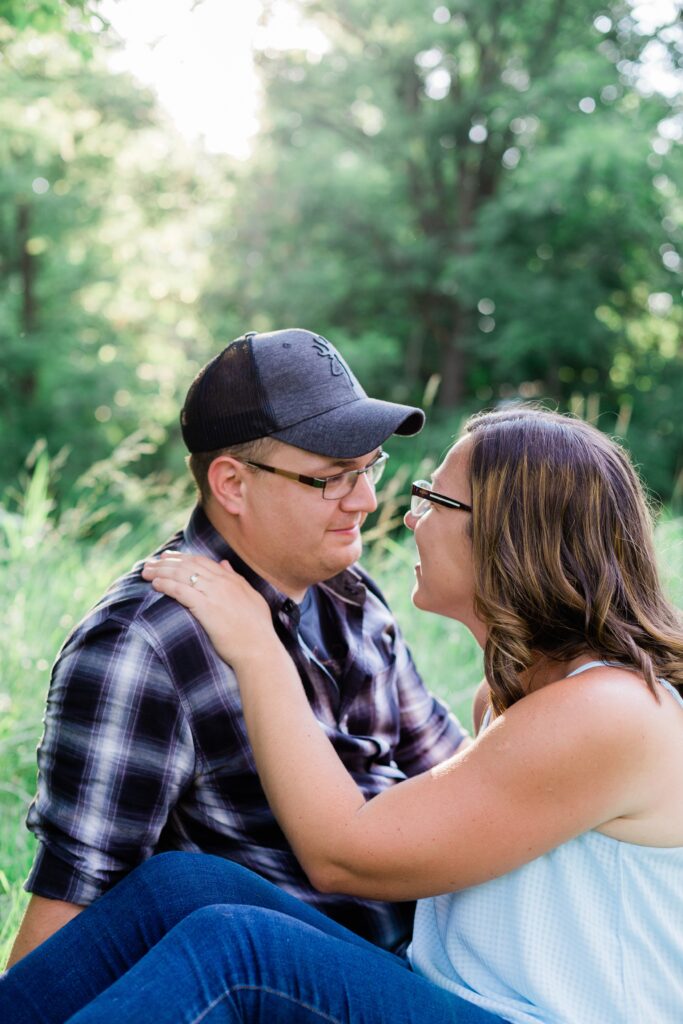 Couple smiling at each other during engagement photos
