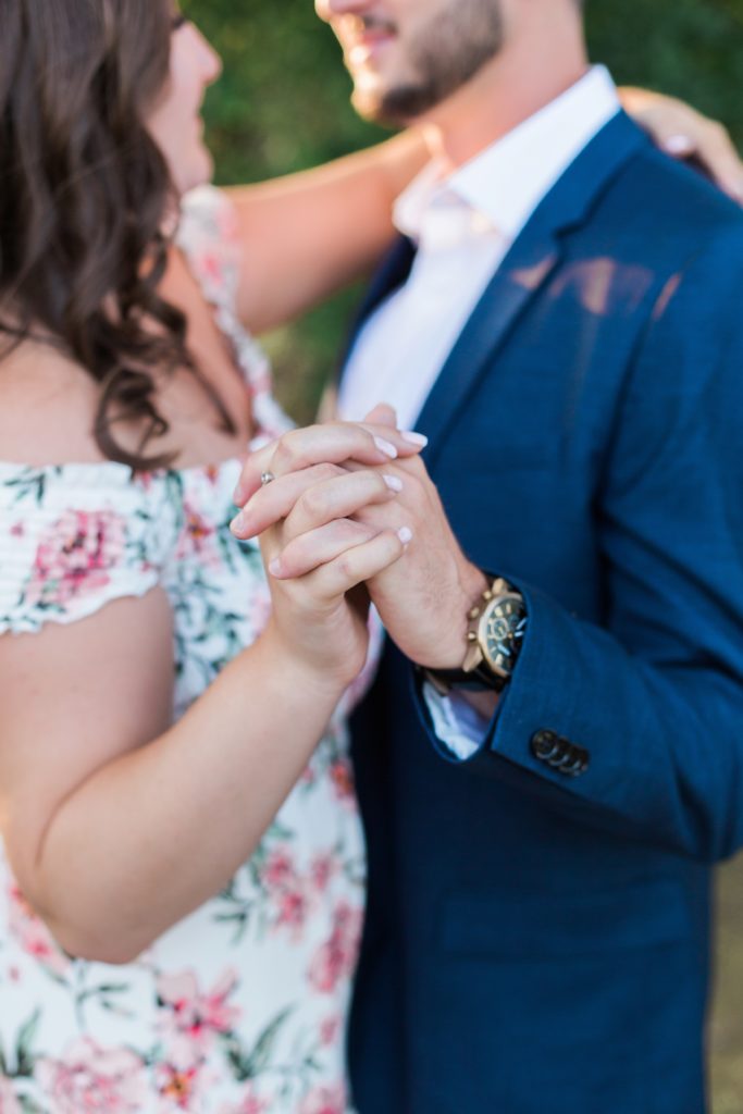 couple holding hands engagement photo
