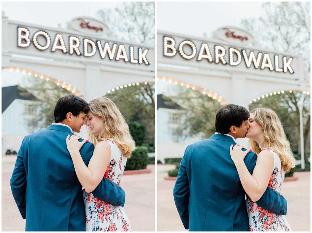 couple snuggled under the marquee sign at Disney's boardwalk resort