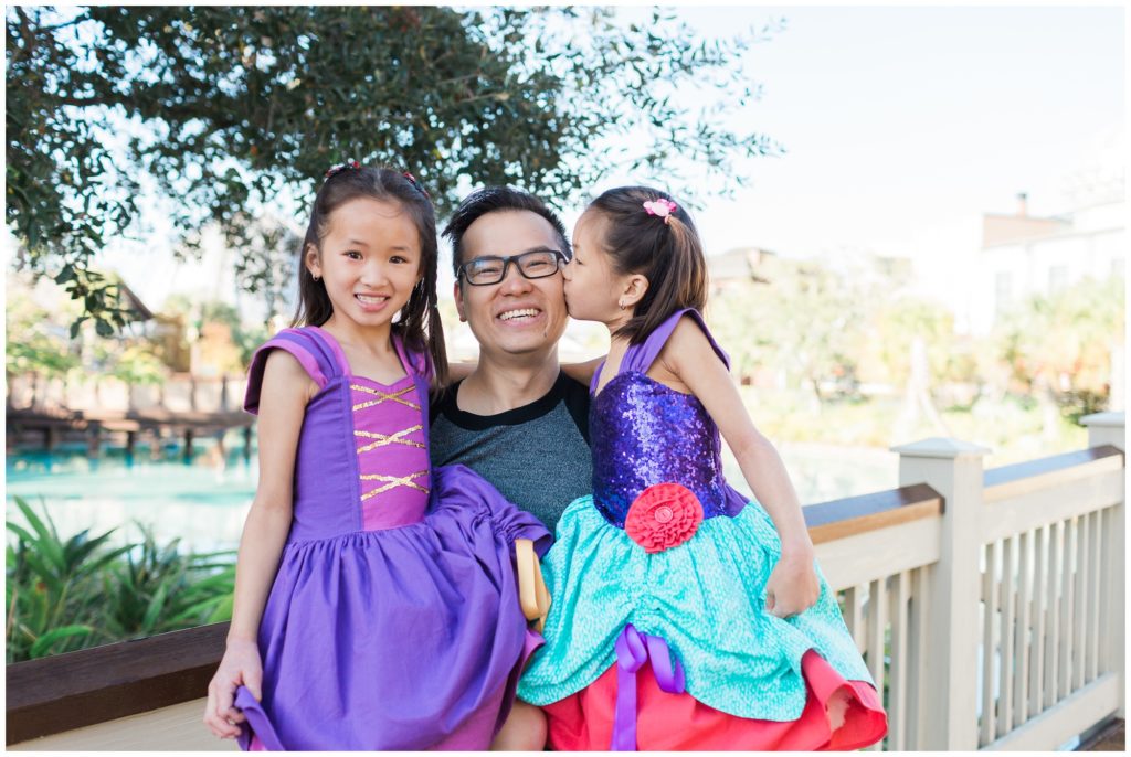 father and daughters at disney springs