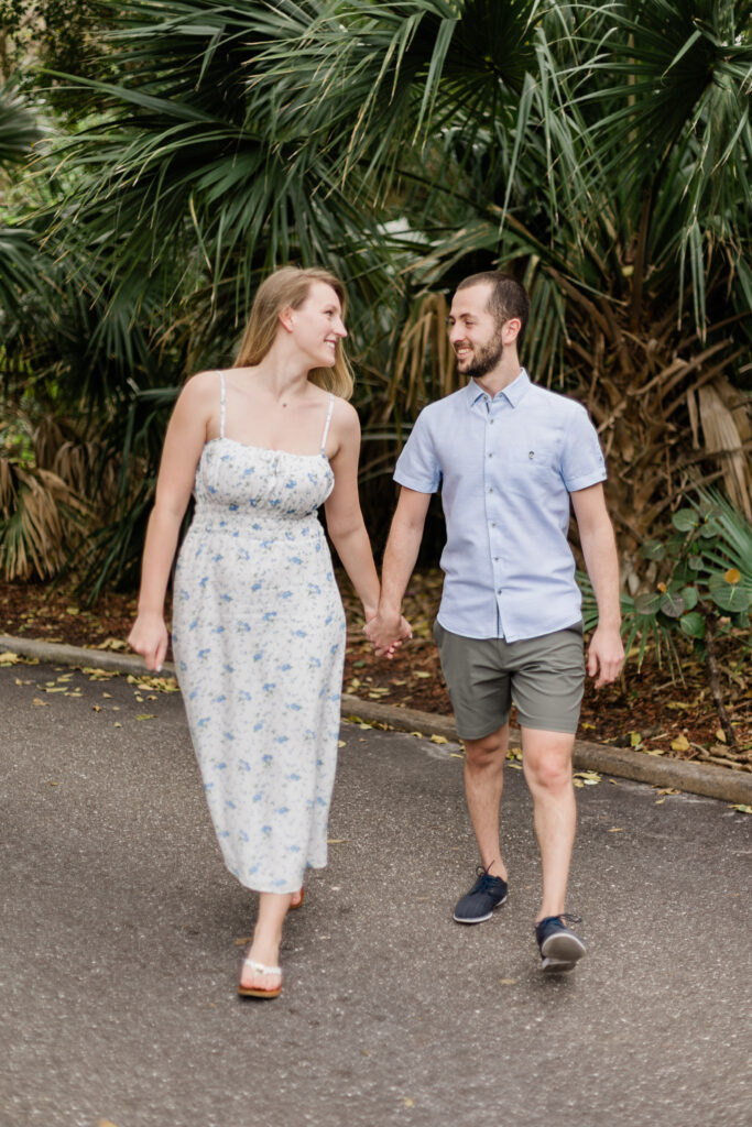 Couple walking in Boca Raton, Florida during their destination engagement session