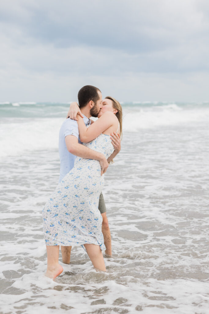 engaged couple kissing during their destination session in Boca Raton, Florida