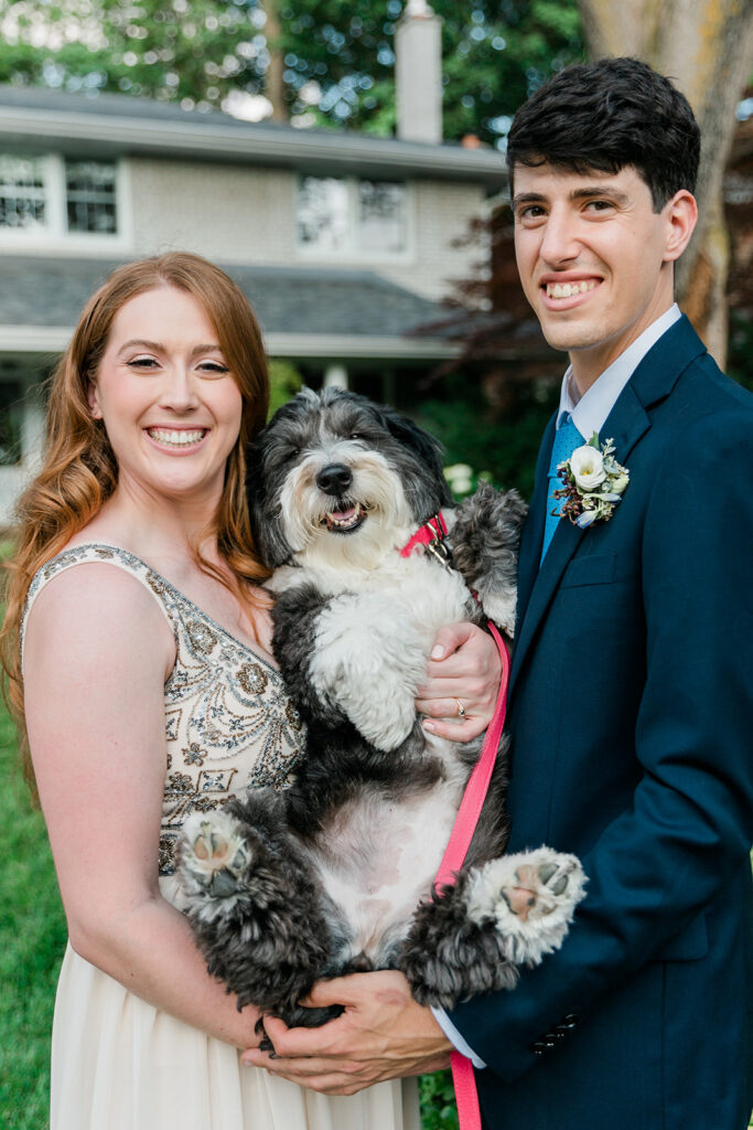 bride and groom bring their dog to their intimate backyard elopement