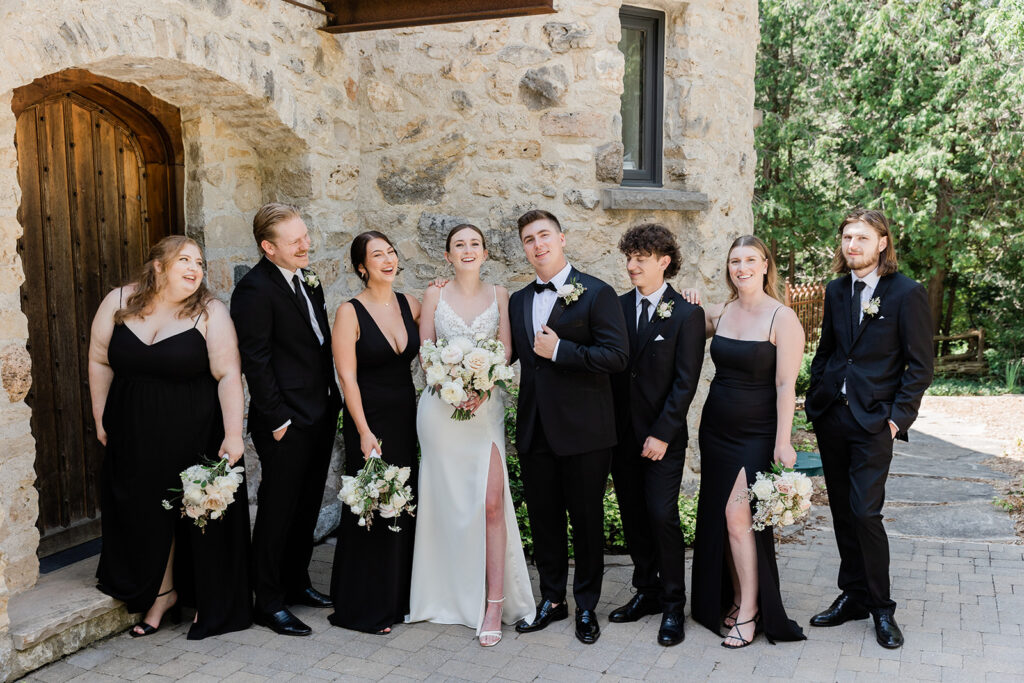 full wedding party photo outside of Cedar Cliff