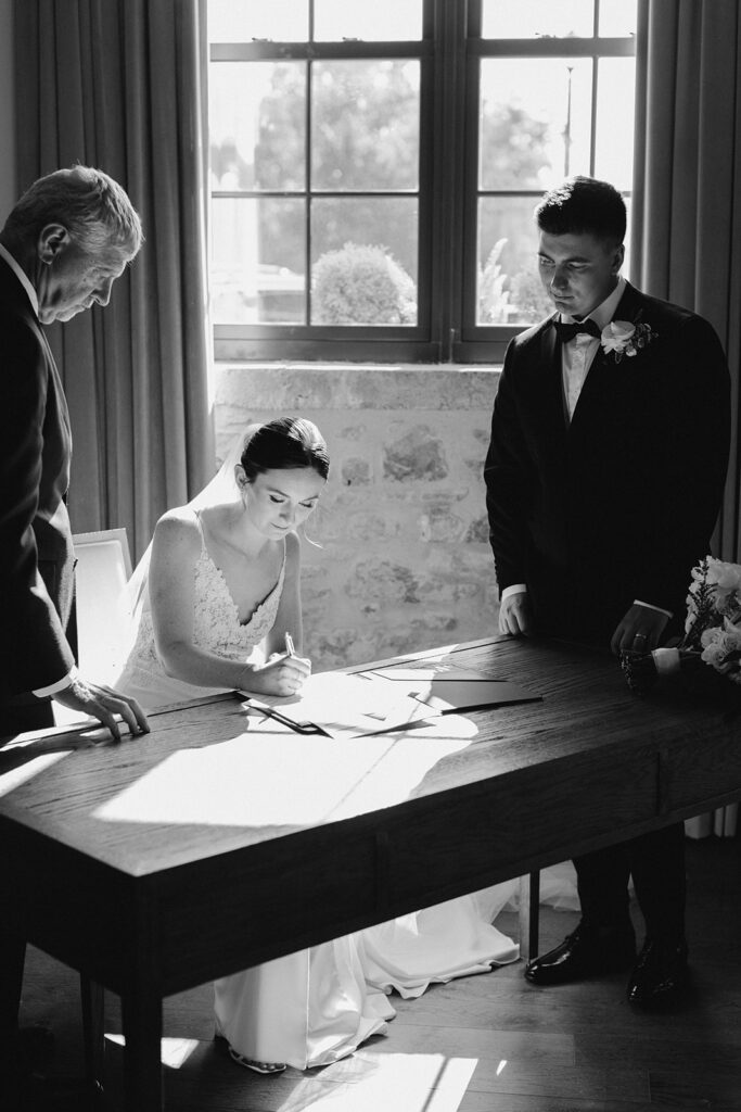 bride signing her marriage license