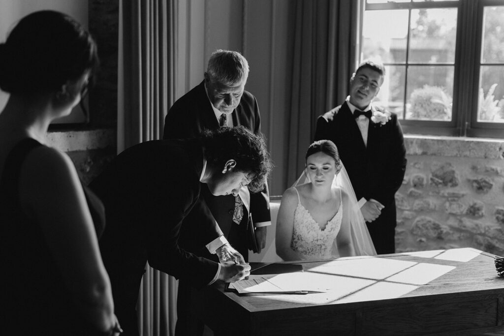 best man signing the marriage license