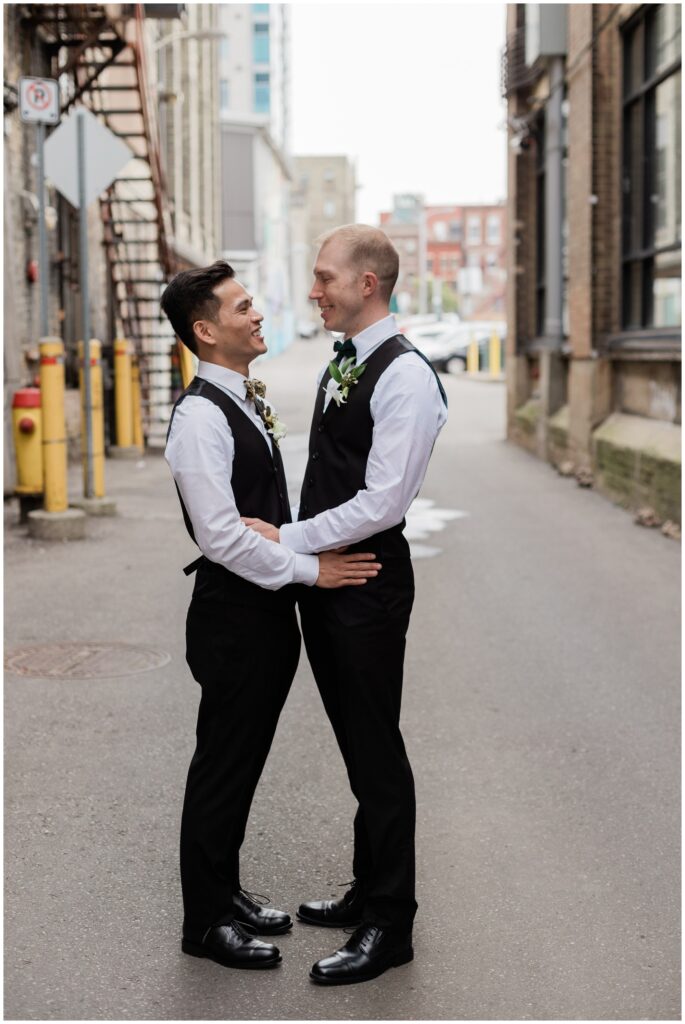 downtown wedding in Kitchener alley with wedding couple