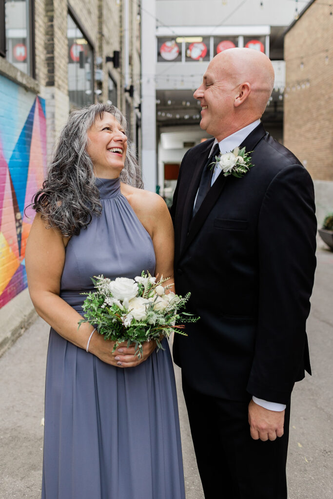 couple and wedding party in Geddes Lane in Downtown Kitchener before Walper Hotel Wedding