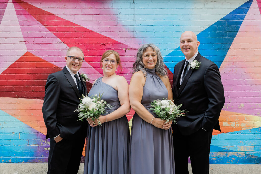 couple and wedding party in Geddes Lane in Downtown Kitchener before Walper Hotel Wedding