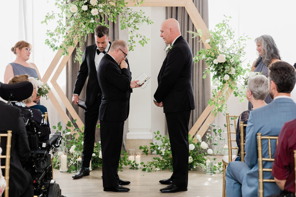 grooms exchange personal vows at Walper Hotel Wedding Ceremony