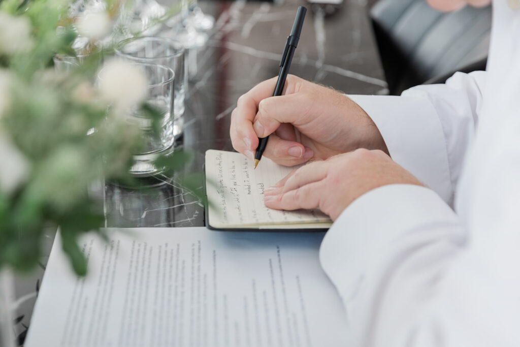 groom writing vows at for Walper Hotel Wedding